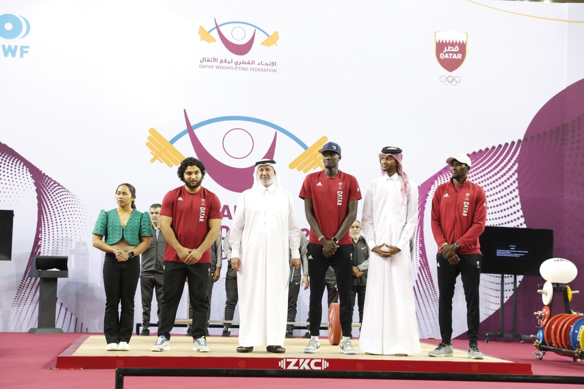 The First Vice President of the Qatar Olympic Committee and President of the Qatar, Arab and Asian Weightlifting Federations Mohammed bin Youssef Al Mana, and Qatar's Olympic medallists Fares Ibrahim, Mutaz Barshim, Cherif Younousse and Ahmed Tijan, during a ceremony that marked the opening of the Qatar Cup IWF Grand Prix II 2023 Weightlifting Championships, yesterday.