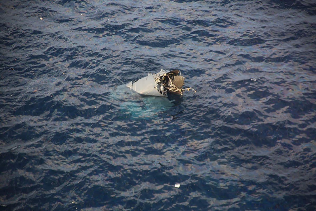 This handout photo taken on November 29, 2023 by Japan's 10th Regional Coast Guard Headquarters and received via Jiji Press shows the remains of a US Osprey aircraft that crashed at sea off the island of Yakushima. Photo by Handout / various sources / AFP