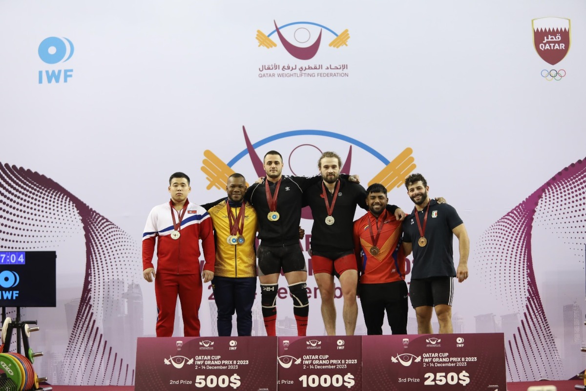 Gold medallist, Bulgaria’s Karlos May Nasar (third left), celebrates on the podium with other medallists in the men's 89kg weight class.