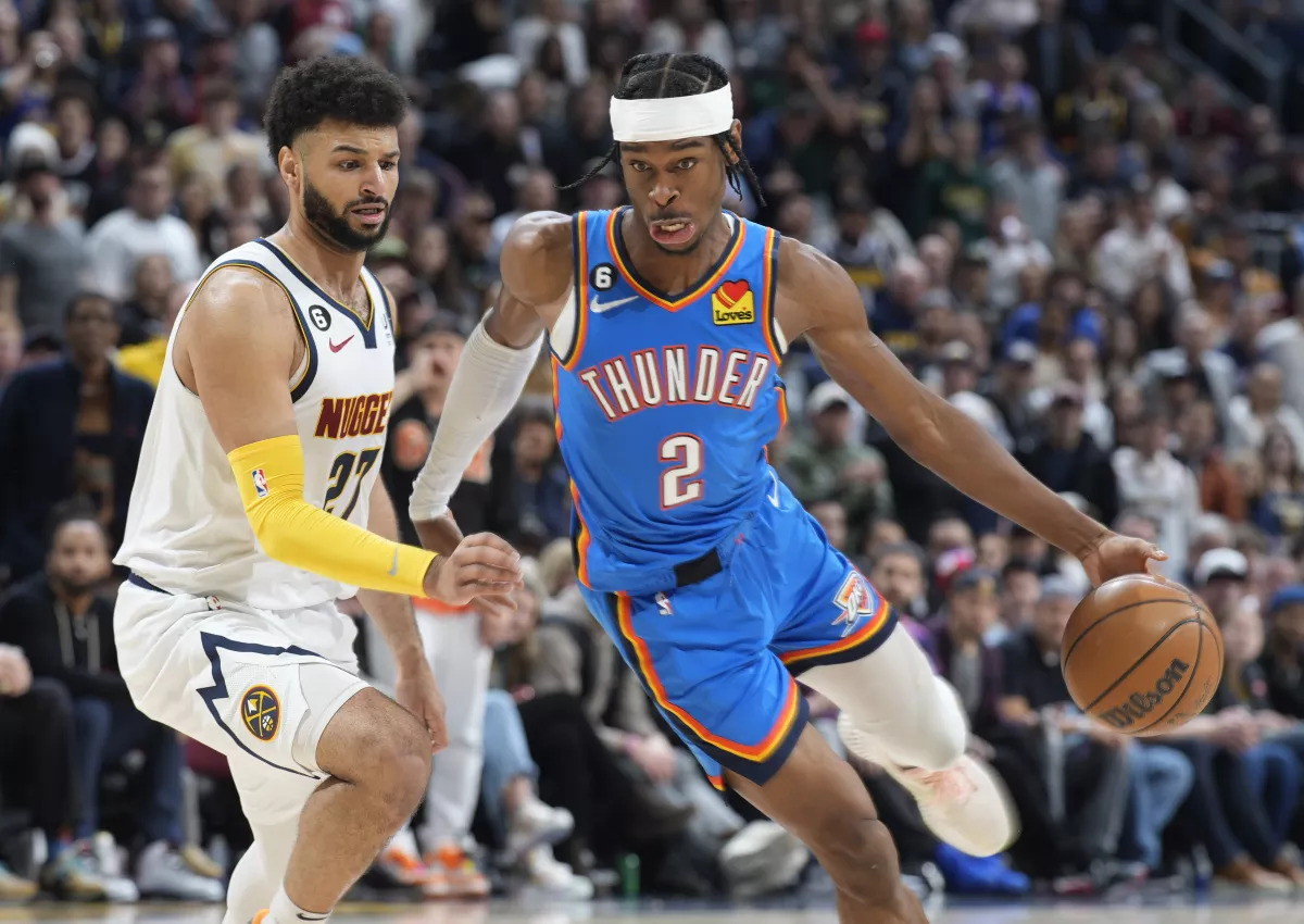 File photo: Oklahoma City Thunder guard Shai Gilgeous-Alexander, right, drives past Denver Nuggets guard Jamal Murray in the second half of an NBA basketball game Sunday, Jan. 22, 2023, in Denver. David Zalubowski / Associated Press

