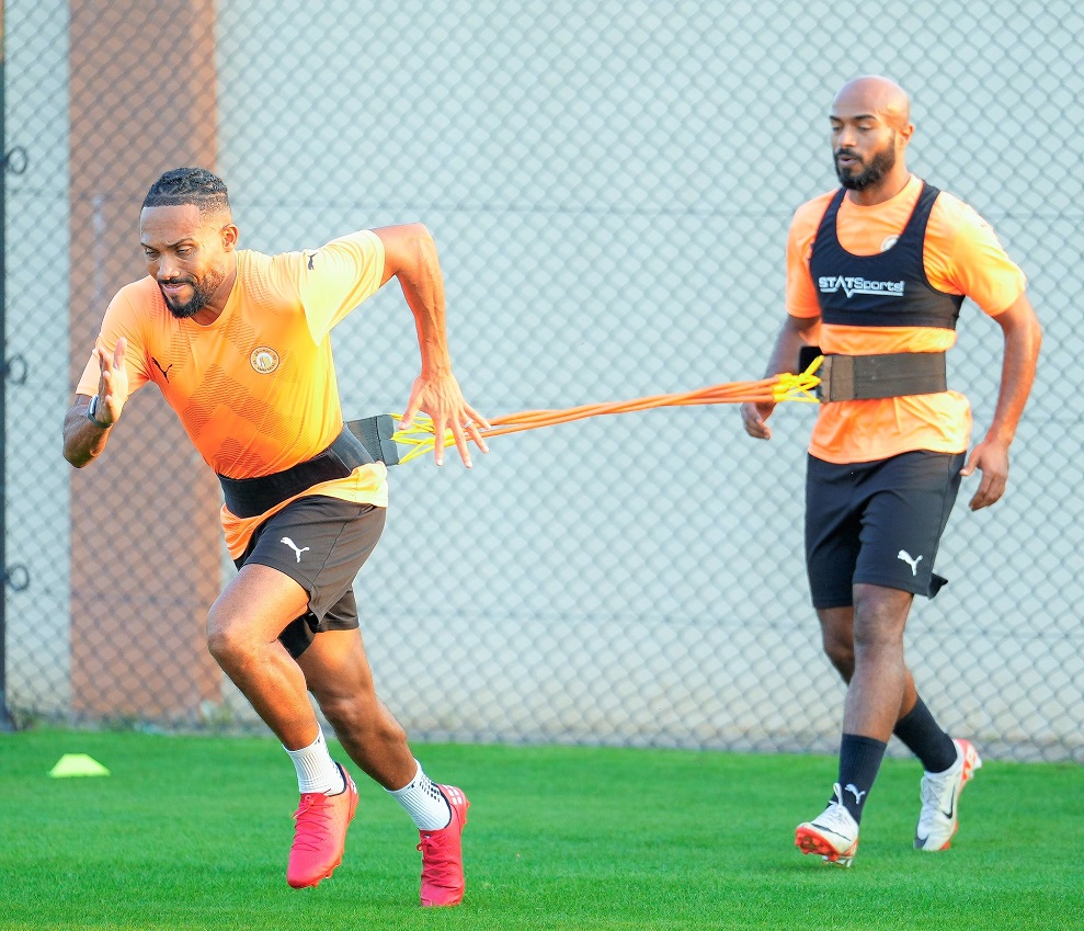 Umm Salal and Al Ahli players in action during their training sessions in these file photos.    