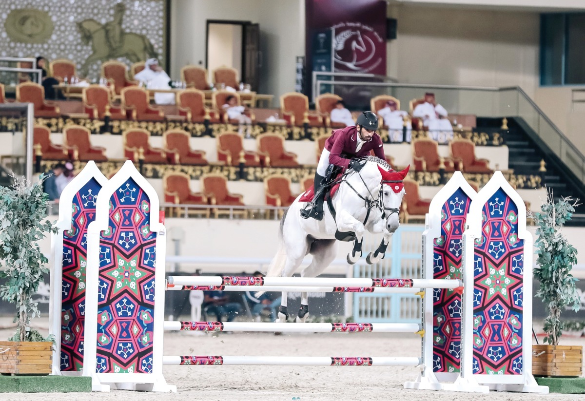 Mohammed Dhafi Al Marri guides Destiny 297 over a fence during the Small Tour event.