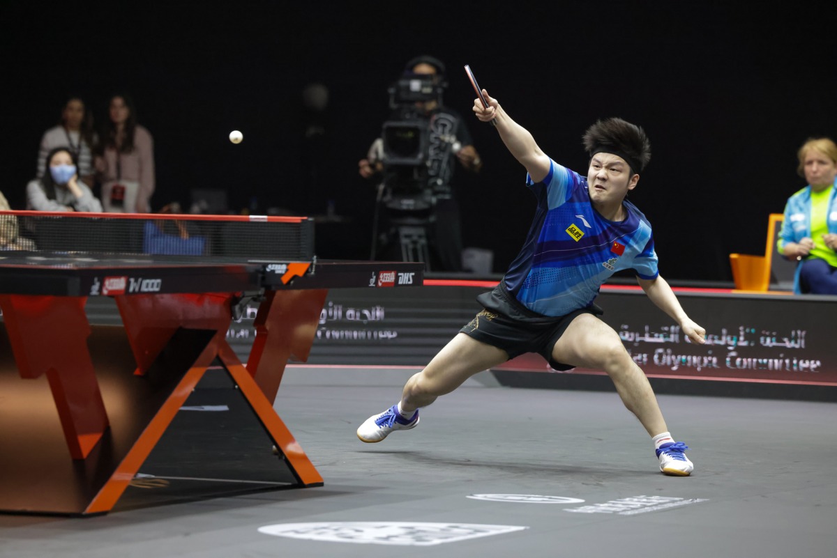 Fan Zhendong hits a shot against Darko Jorgic.