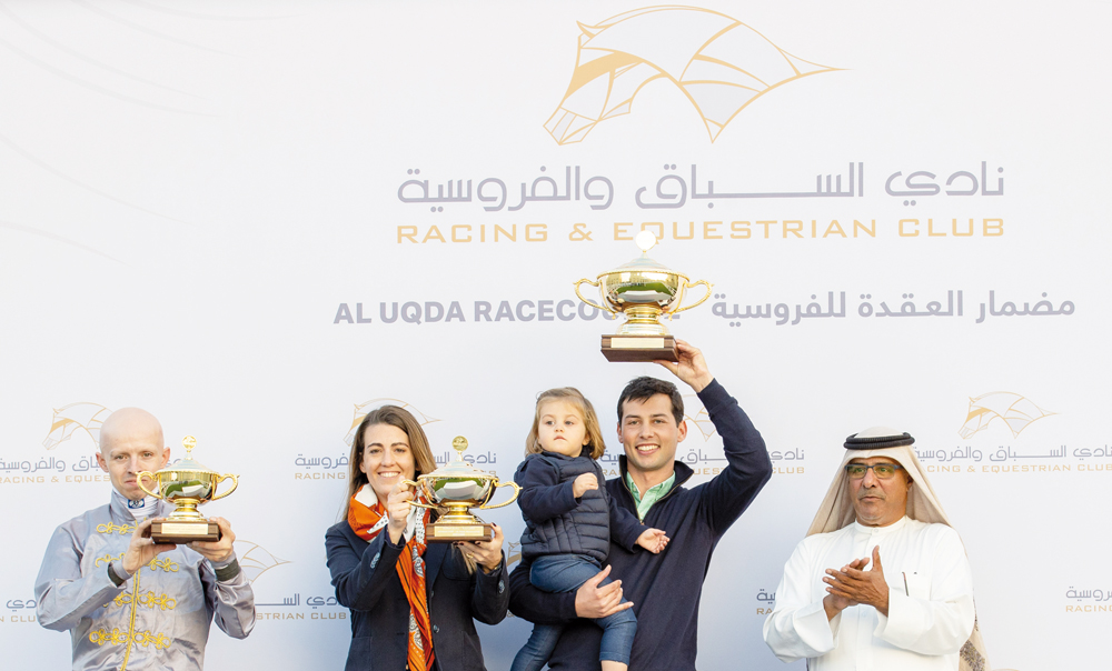 Al Zwair's connections celebrate with the trophy after winning the Athbah Cup title at Al Uqda Racecourse yesterday. Pics: Juhaim/QREC
