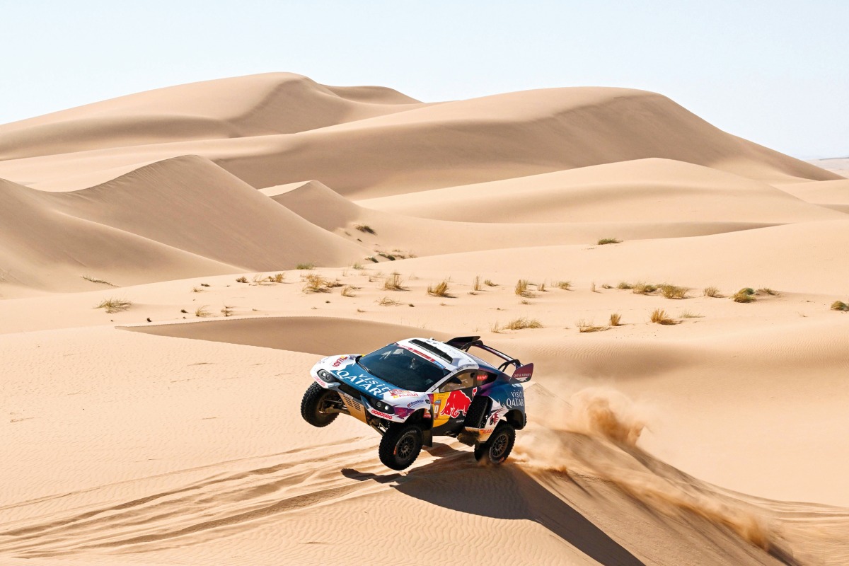 Nasser Racing’s Qatari driver Nasser Al Attiyah and his French co-driver Mathieu Baumel compete during Stage 3 of the Dakar Rally 2024. AFP