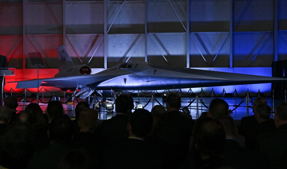 NASA's and Lockheed Martin's X-59 experimental supersonic jet is unveiled during a roll-out ceremony in Palmdale, California, on January 12, 2024. (Photo by Robyn Beck / AFP)