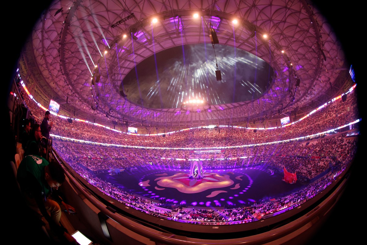 This picture taken with a fisheye lens shows lights illuminating the opening ceremony of the AFC Qatar 2023 Asian Cup before the Group A football match between Qatar and Lebanon at the Lusail Stadium in Lusail, north of Doha on January 12, 2024. (Photo by KARIM JAAFAR / AFP)