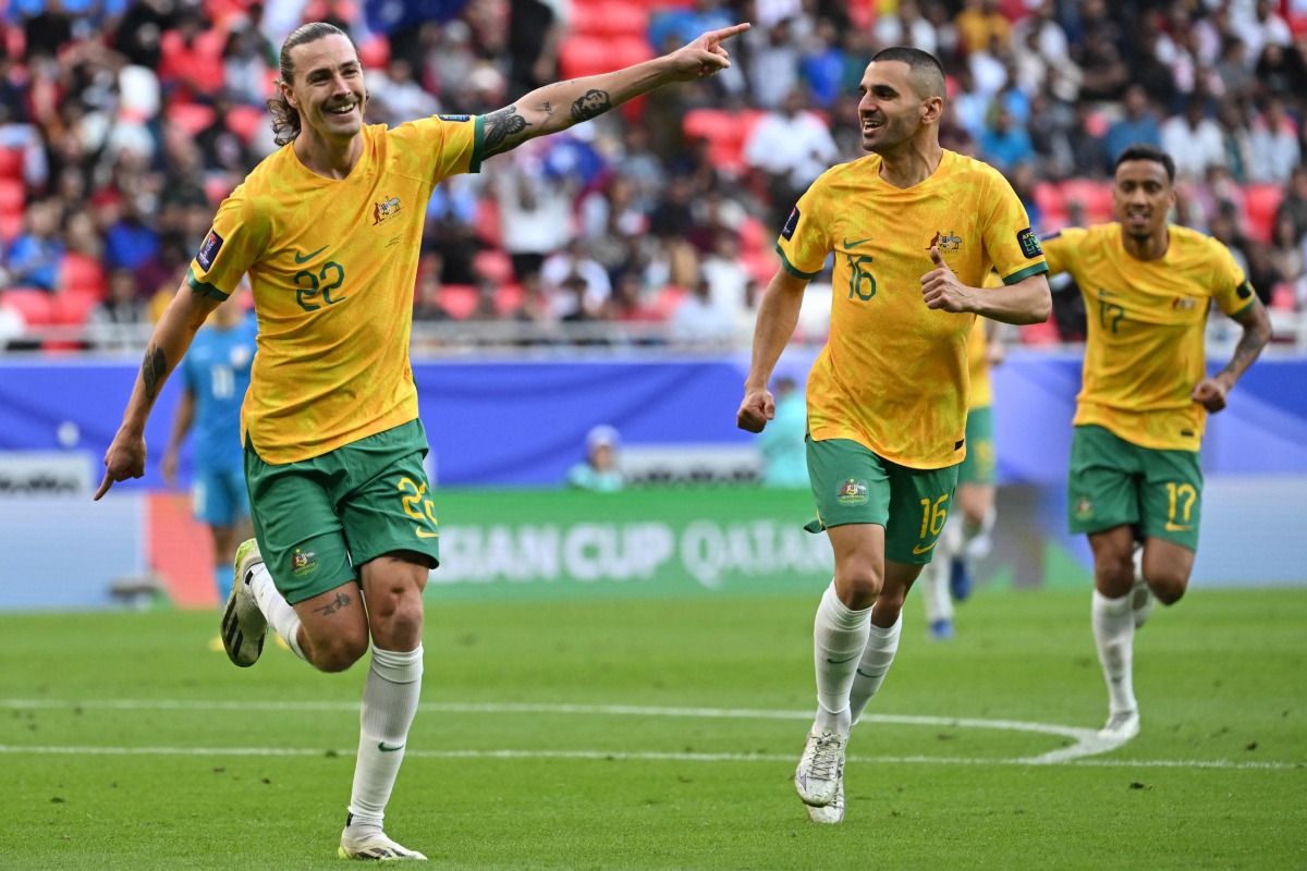 Jackson Irvine (left) celebrates with teammates after scoring Australia’s first goal against India, yesterday. AFP