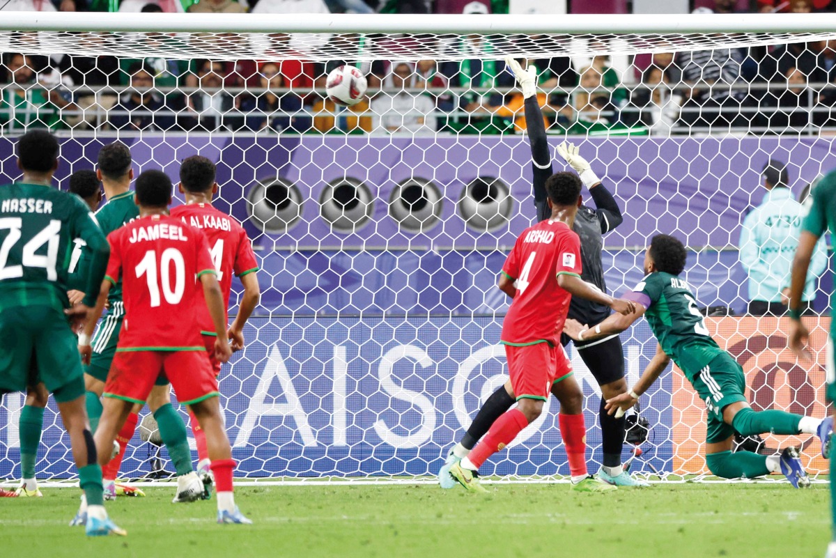 Saudi Arabia’s Ali Al Bulayhi (right) scores the winning goal. AFP