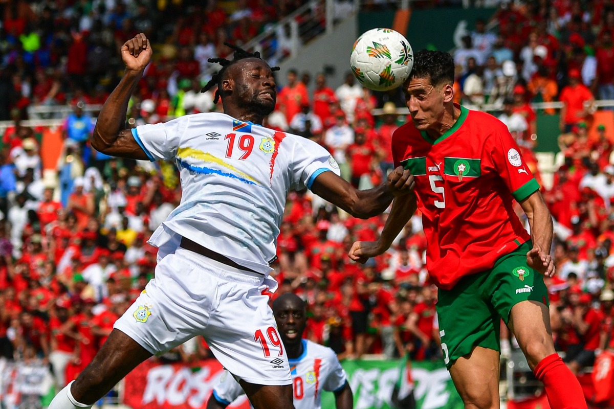 DR Congo's forward #19 Fiston Mayele (L) fights for the ball with morocco's defender #5 Nayef Aguerd during the Africa Cup of Nations (CAN) 2024 group F football match between morocco and DR Congo at Stade Laurent Pokou in San Pedro on January 21, 2024. (Photo by SIA KAMBOU / AFP)
