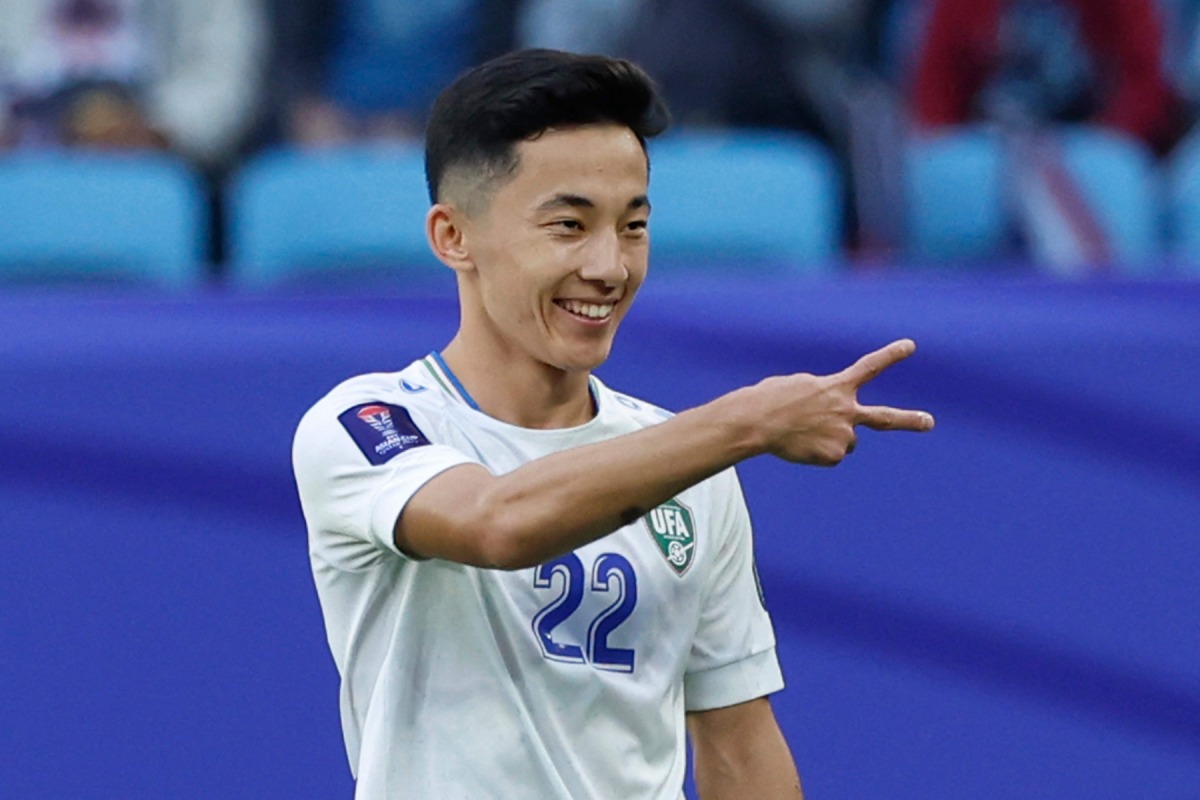 Uzbekistan’s midfielder Abbosbek Fayzullaev celebrates after scoring his team’s second goal. AFP