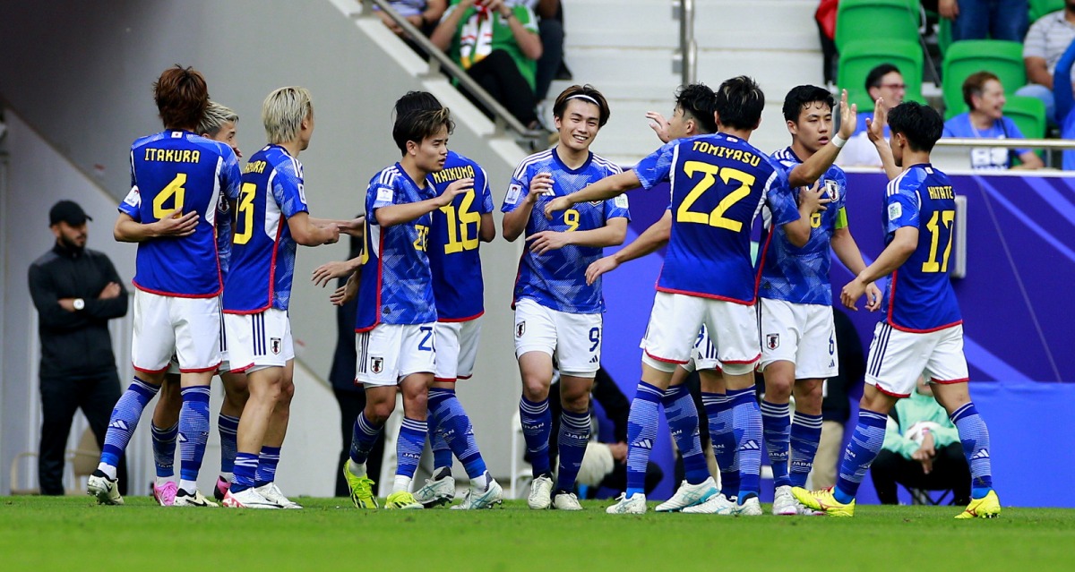 Japan players celebrate after Ayase Ueda (centre) scored their third goal against Bahrain. Pictures: Rajan Vadakkemuriyil/The Peninsula