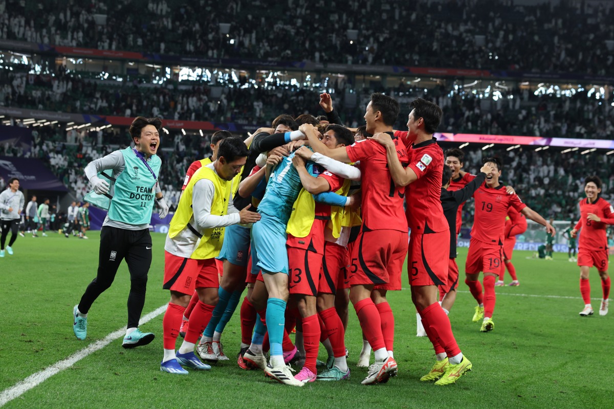 South Korea players celebrate their Round of 16 victory against Saudi Arabia.