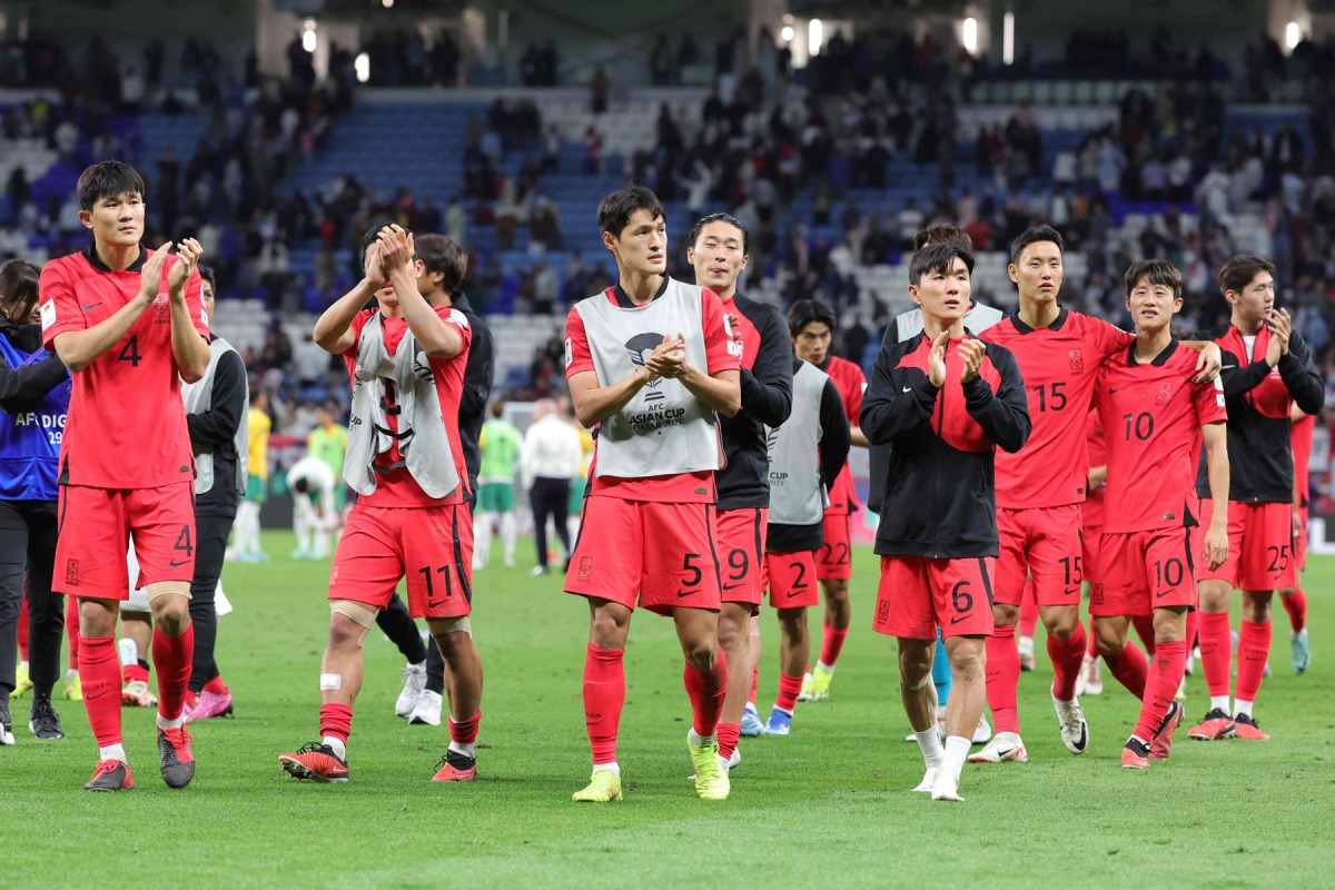 South Korea players walk off the pitch after their win. Pics: Rajan Vadakkemuriyil / The Peninsula