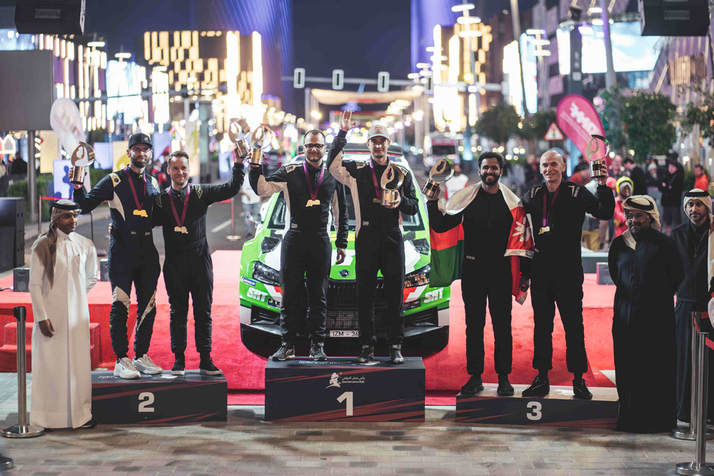 QMMF President Abdulrahman Al Mannai (second right), Executive Director Amro Al Hamad (left) and Secretary General Abdul Razzaq Al Kuwari pose with the podium winners at the conclusion of the Qatar International Rally at Lusail Boulevard yesterday.