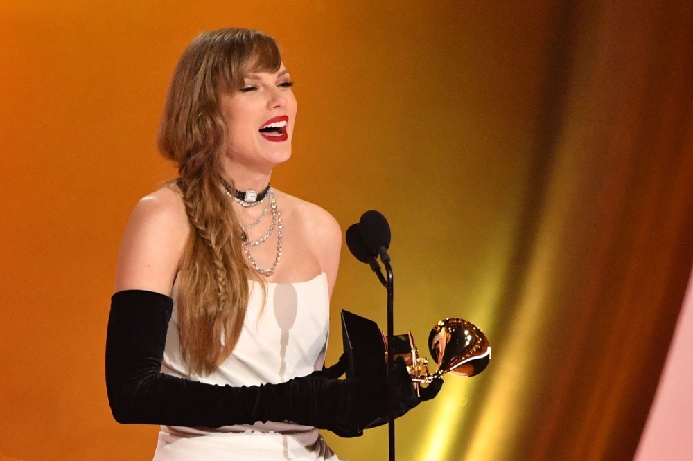 US singer-songwriter Taylor Swift accepts the Best Pop Vocal Album award for 