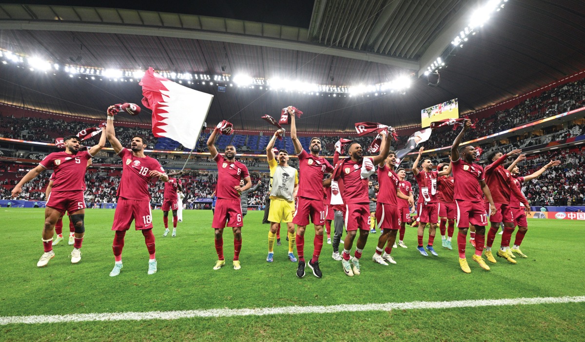 Qatar players celebrate after qualifying for the semi-final on Saturday.