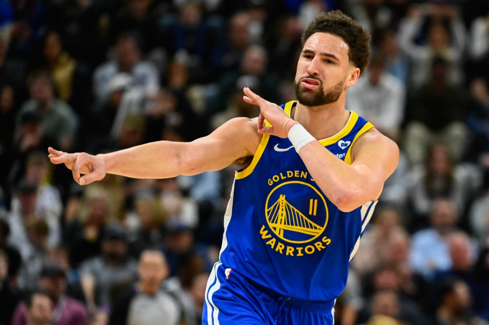 Klay Thompson #11 of the Golden State Warriors celebrates a three point shot during the second half of a game against the Utah Jazz at Delta Center on February 15, 2024 in Salt Lake City, Utah. Photo by Alex Goodlett / GETTY IMAGES NORTH AMERICA / Getty Images via AFP