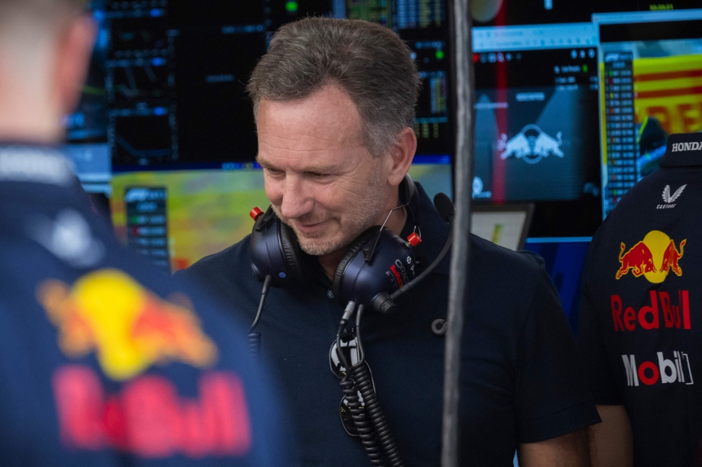 Red Bull Racing's team principal Christian Horner is seen in the team garage during the first day of the Formula One pre-season testing at the Bahrain International Circuit in Sakhir on February 21, 2024. (Photo by Andrej ISAKOVIC / AFP)