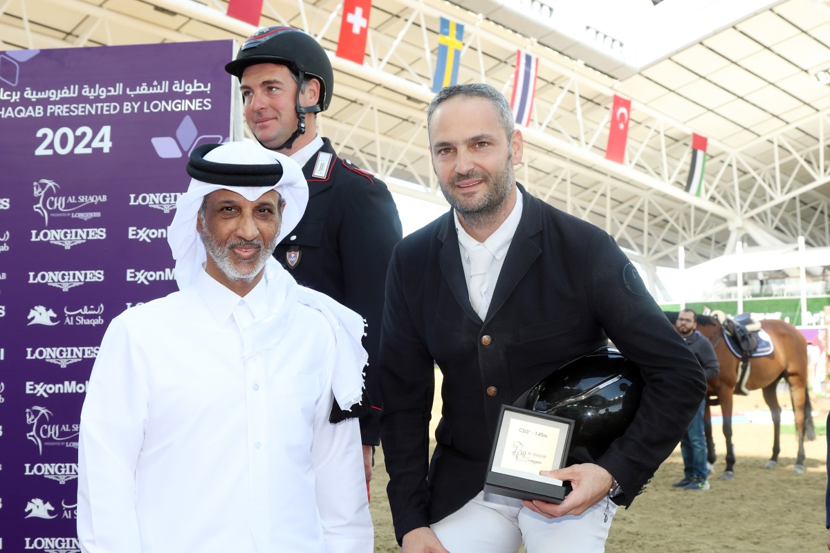 Minister of Sports and Youth H E Sheikh Hamad bin Khalifa bin Ahmed Al Thani with CSI3* - 1.45m class winner Ibrahim Hani Bisharat of Jordan (right) and runner-up Emanuele Gaudiano of Italy.