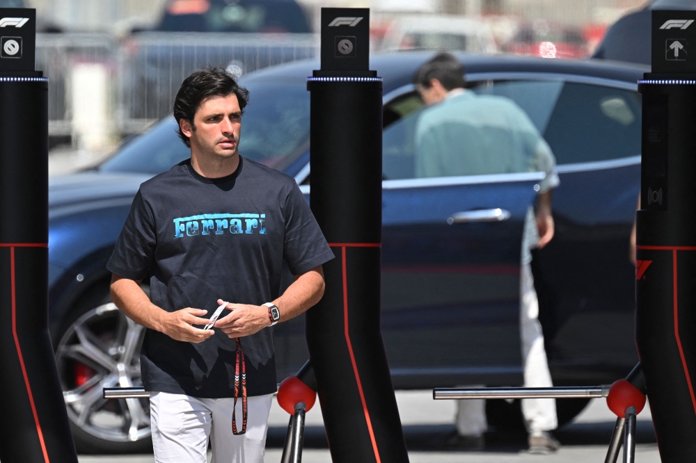 Ferrari's Spanish driver Carlos Sainz Jr arrives at the Bahrain International Circuit ahead of the Bahrain Formula One Grand Prix in Sakhir on February 28, 2024. (Photo by ANDREJ ISAKOVIC / AFP)