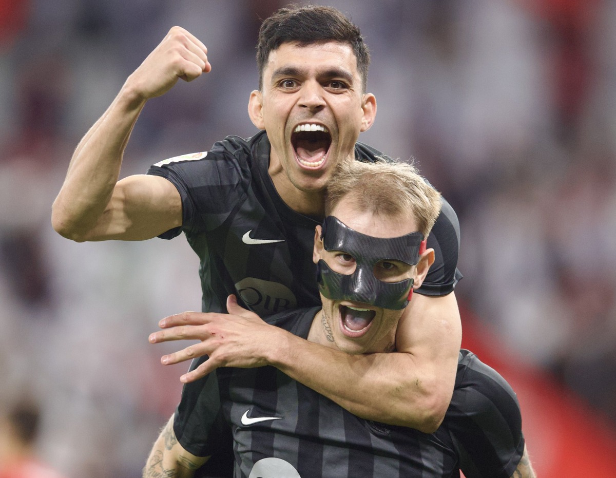 Al Rayyan's Roger Guedes (foreground) celebrates with a teammate. 