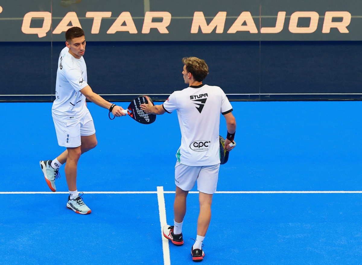 Argentina's Martin Di Nenno (left) and Franco Stupaczuk celebrate after defeating Inigo Jofre and Luis Hernandez Quesada of Spain, yesterday.