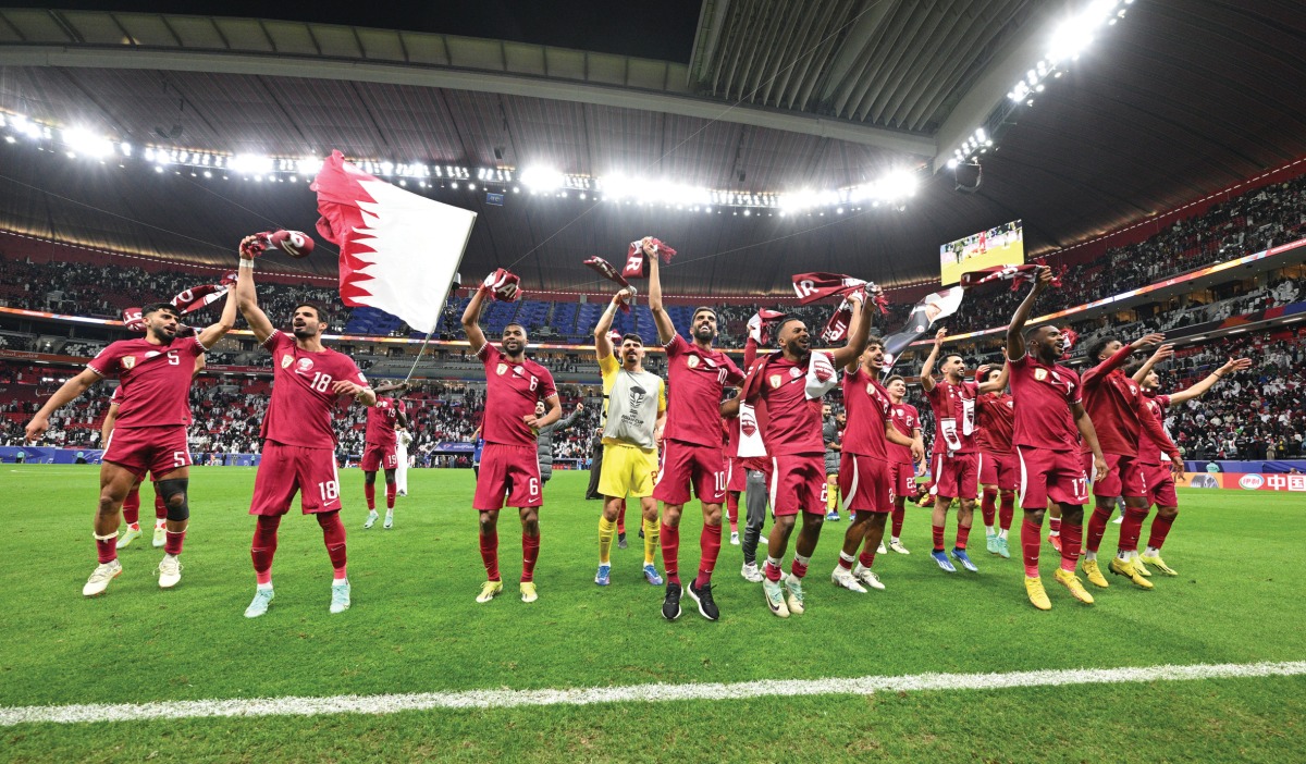 Qatari players celebrating their victory.