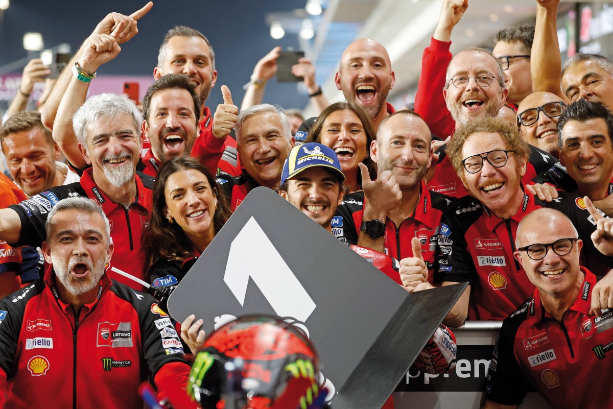 Francesco Bagnaia (centre) celebrates with team members after winning the Qatar MotoGP at the Lusail International Circuit, yesterday. 