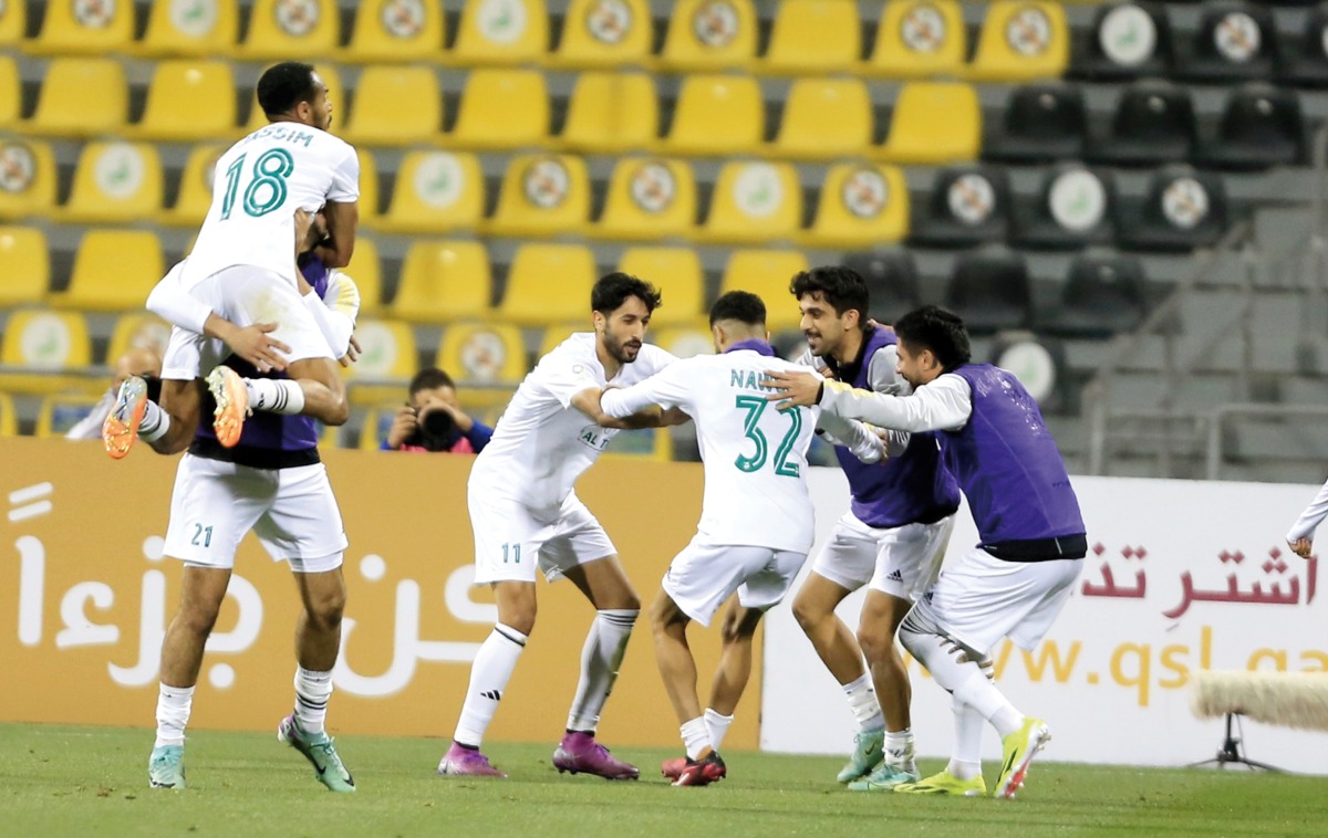 Al Ahli players celebrate after Yazan Al Naimat scored their second goal against Qatar SC, yesterday.