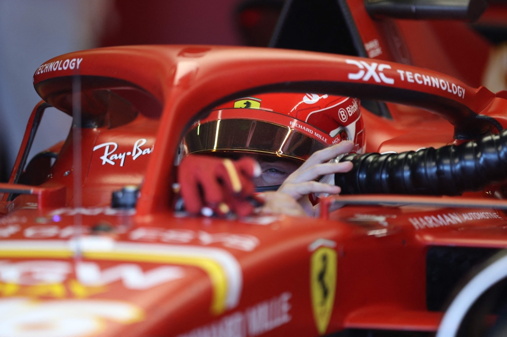 Ferrari's Monegasque driver Charles Leclerc drives in the pit lane during the second practice session of the Formula One Australian Grand Prix at the Albert Park Circuit in Melbourne on March 22, 2024. (Photo by Martin KEEP / AFP) 