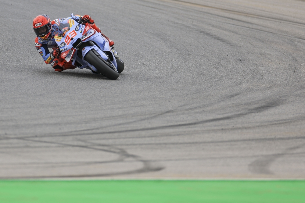 Ducati Spanish rider Marc Marquez takes part in the MotoGP first free practice session of the Portuguese Grand Prix at the Algarve International Circuit in Portimao on March 22, 2024. (Photo by Patricia Atricia De Melo Moreira / AFP)