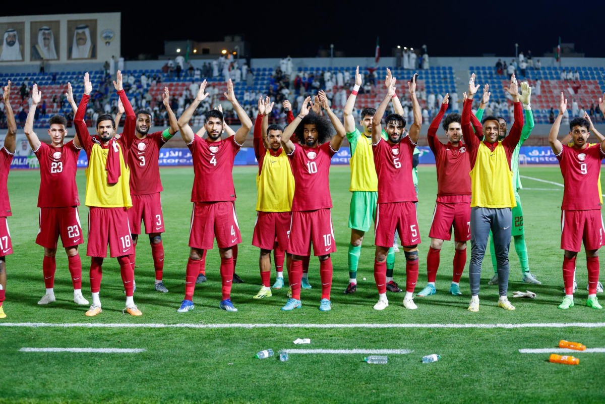 Qatar players acknowledge the supporters after defeating Kuwait yesterday.