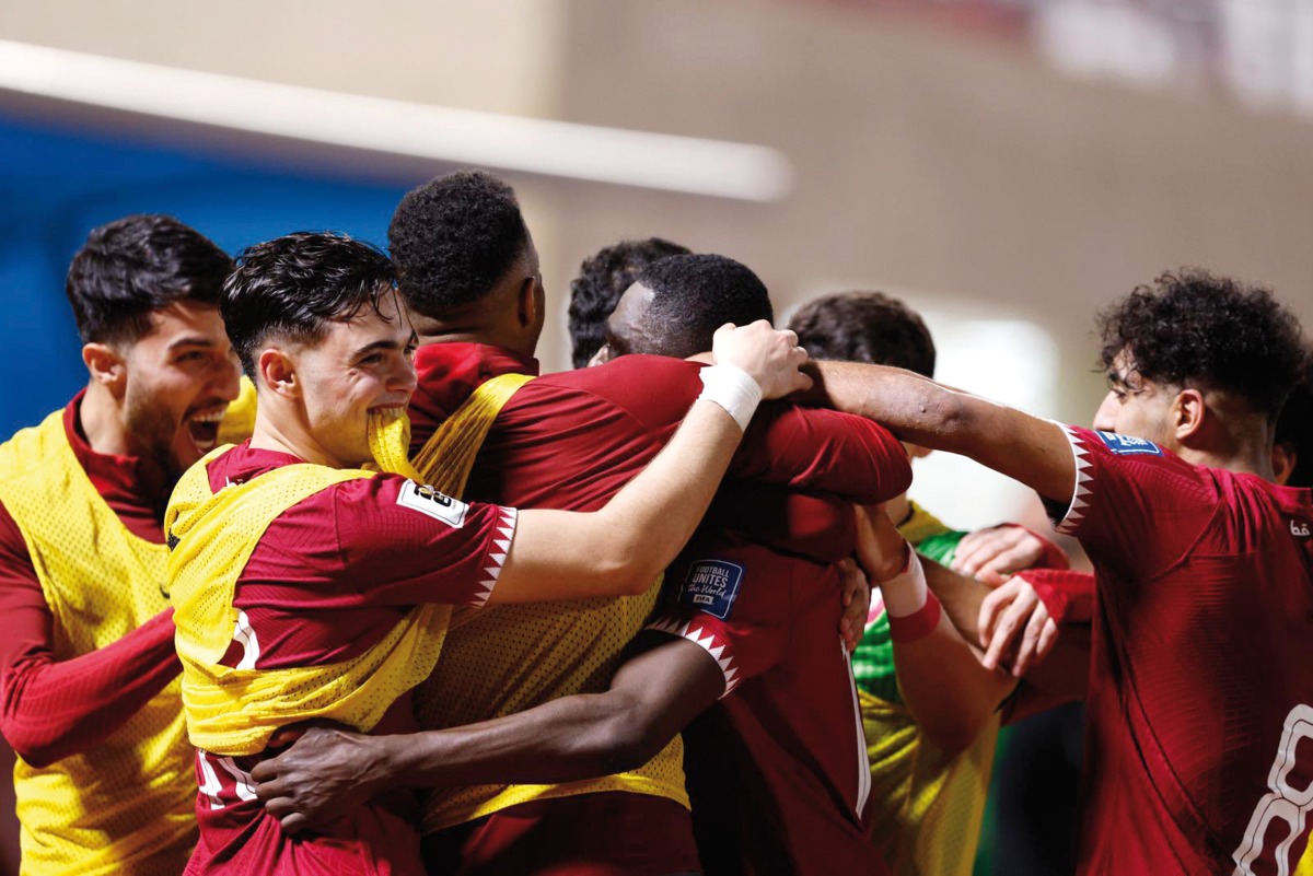 Qatar's Almoez Ali (centre) celebrates with teammates after scoring his team's second goal against Kuwait on Tuesday.