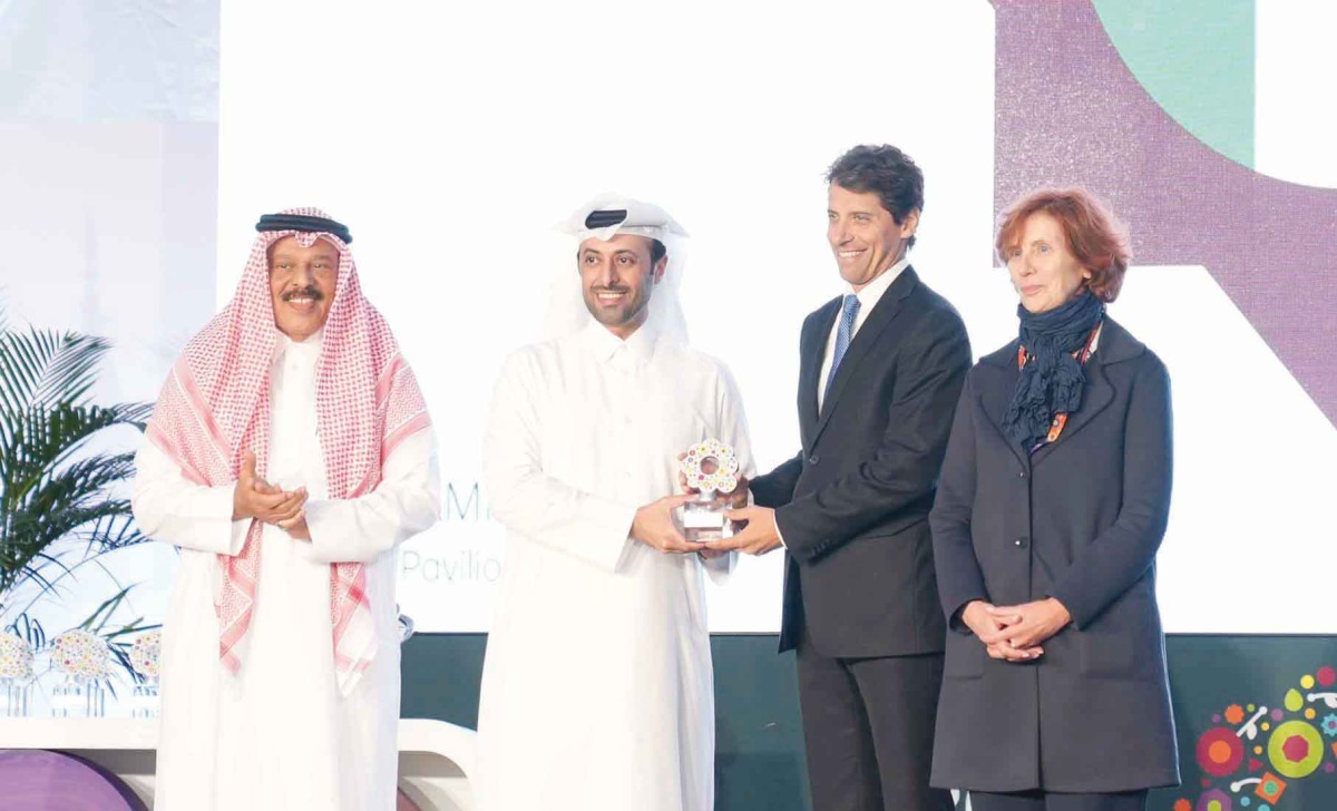  Minister of Municipality H E Abdullah bin Hamad bin Abdullah Al handing over the award to Italian Ambassador to Qatar H E Paolo Toschi.