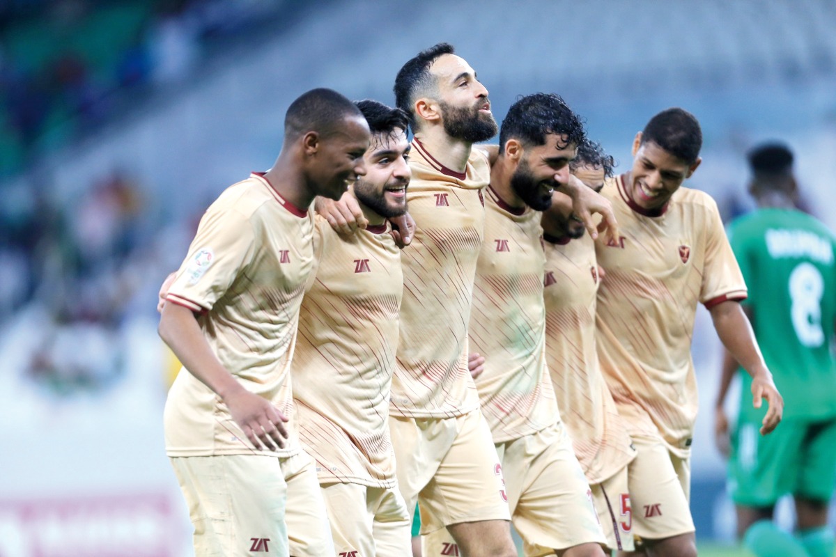 Al Markhiya players celebrate after winning the match.