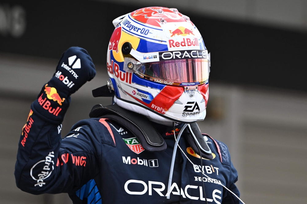 Red Bull Racing's Dutch driver Max Verstappen celebrates winning the Formula One Japanese Grand Prix race at the Suzuka circuit in Suzuka, Mie prefecture on April 7, 2024. (Photo by Philip FONG / AFP)