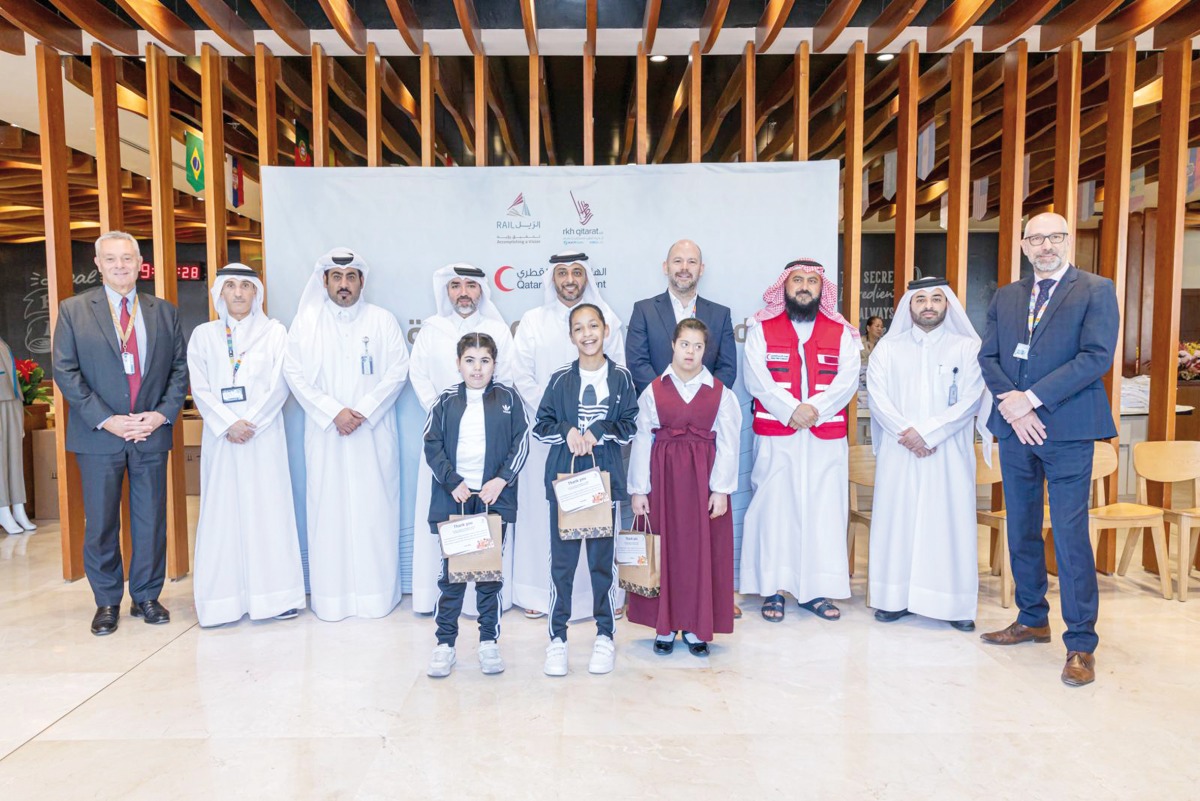 Officials and students at the donation event. 