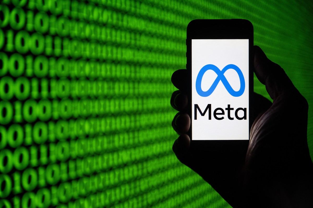 This picture taken on March 25, 2024, shows the Meta logo on a smartphone in Mulhouse, eastern France. Photo by SEBASTIEN BOZON / AFP