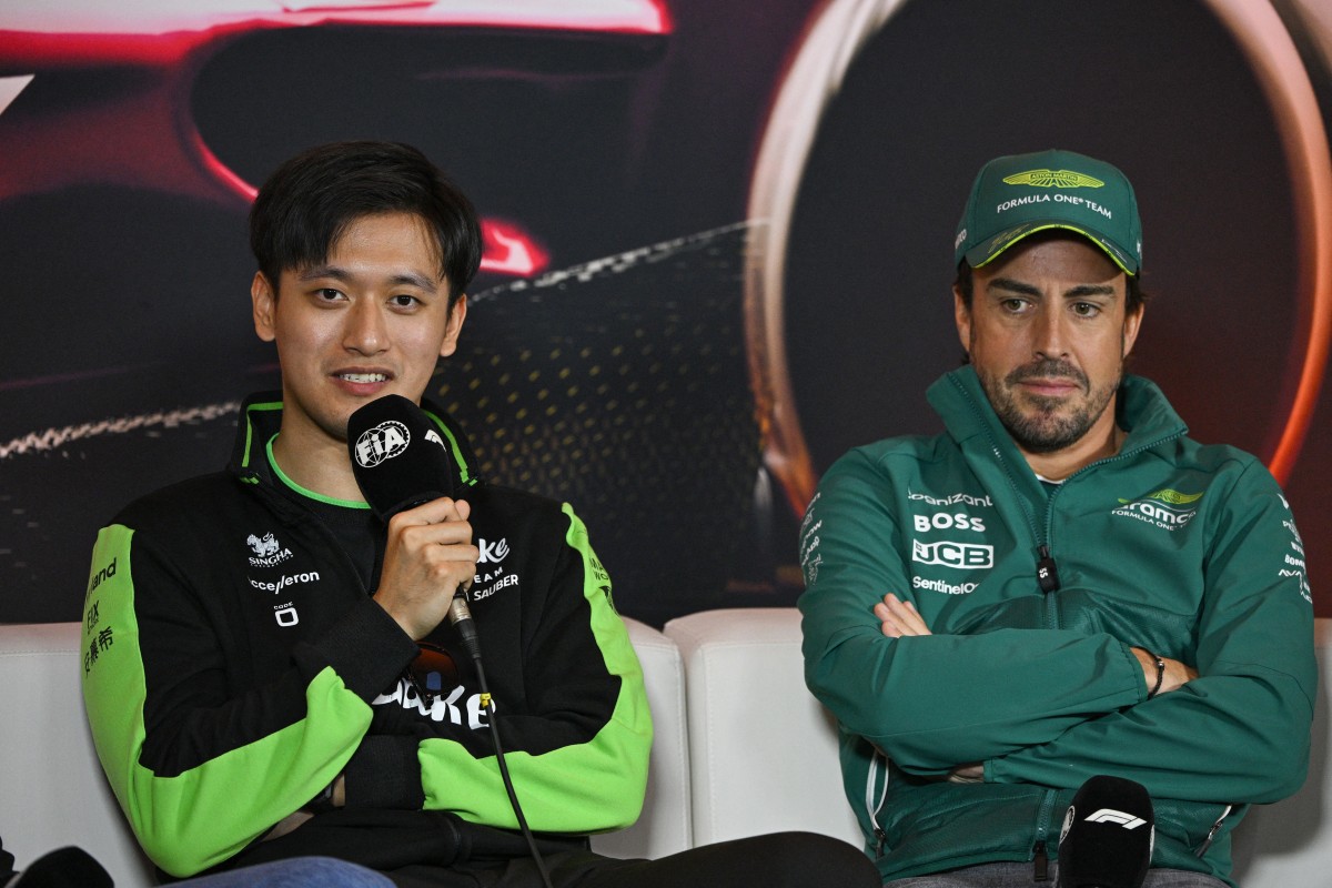 Kick Sauber's Chinese driver Zhou Guanyu (L) speaks as Aston Martin's Spanish driver Fernando Alonso (R) listens during a presse conference at the Shanghai International circuit ahead of the Formula One Chinese Grand Prix in Shanghai on April 18, 2024. (Photo by Hector RETAMAL / AFP)
