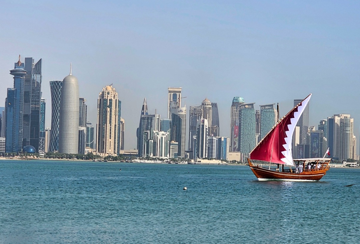 A dhow donning a Qatari flag sails smoothly on calm waters along the Corniche. According to QMD, the weather this weekend (April 19-20) will be relatively hot. (Photo by Marivie Alabanza / The Peninsula) 