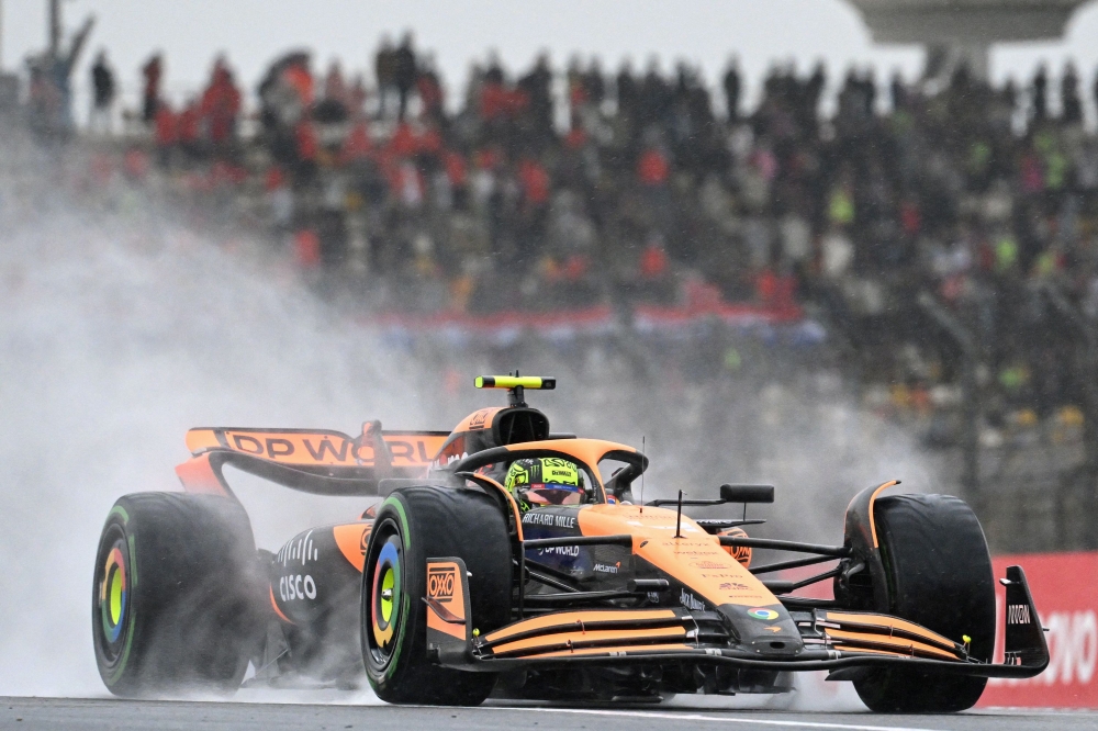 McLaren's British driver Lando Norris drives during the sprint qualifying session ahead of the Formula One Chinese Grand Prix at the Shanghai International Circuit in Shanghai on April 19, 2024. (Photo by GREG BAKER / AFP)