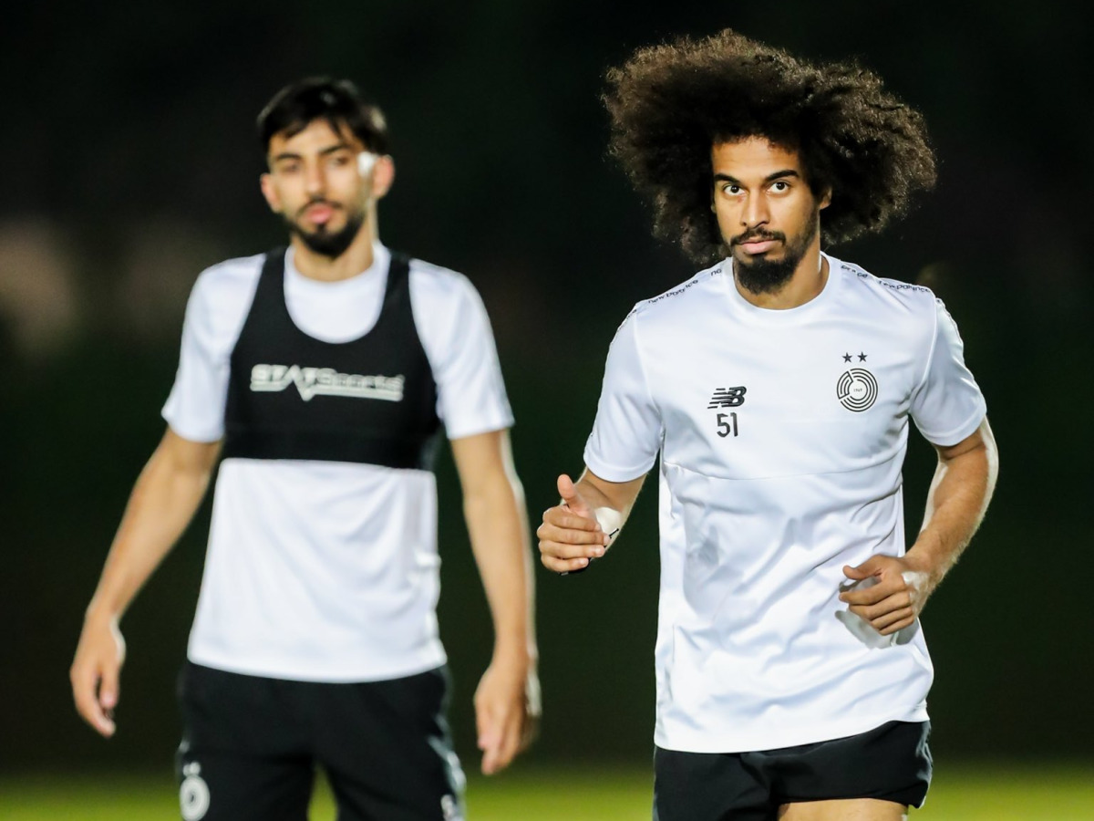 Al Sadd’s Akram Afif (right) and Tarek Salman attend team’s training session yesterday.