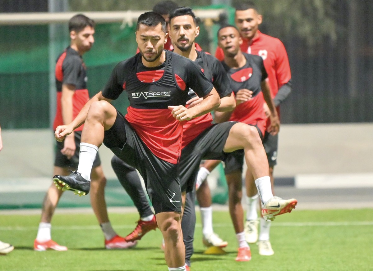 Al Rayyan's Rodrigo Tabata (foreground) trains with teammates during a training session yesterday.