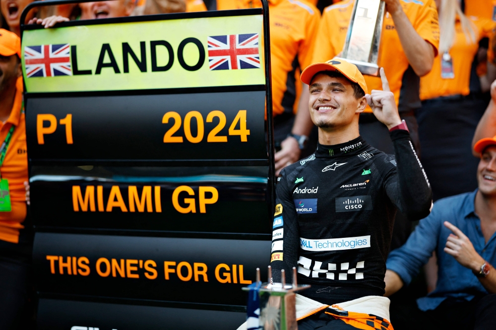 Race winner Lando Norris of Great Britain and McLaren celebrates victory with his team after the F1 Grand Prix of Miami at Miami International Autodrome on May 05, 2024 in Miami, Florida. Chris Graythen/Getty Images/AFP 