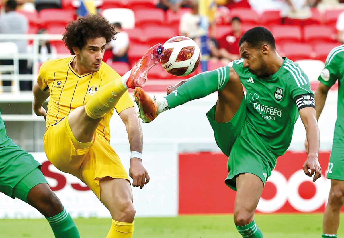 Al Gharafa's Ahmed Alaaeldin (left) in action during yesterday's match against Al Ahli. Pic: Mohamed Farag / The Peninsula