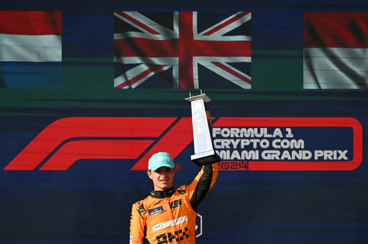 McLaren's British driver Lando Norris celebrates on the podium after winning the 2024 Miami Formula One Grand Prix at Miami International Autodrome in Miami Gardens, Florida, on May 5, 2024. (Photo by Jim WATSON / AFP)
