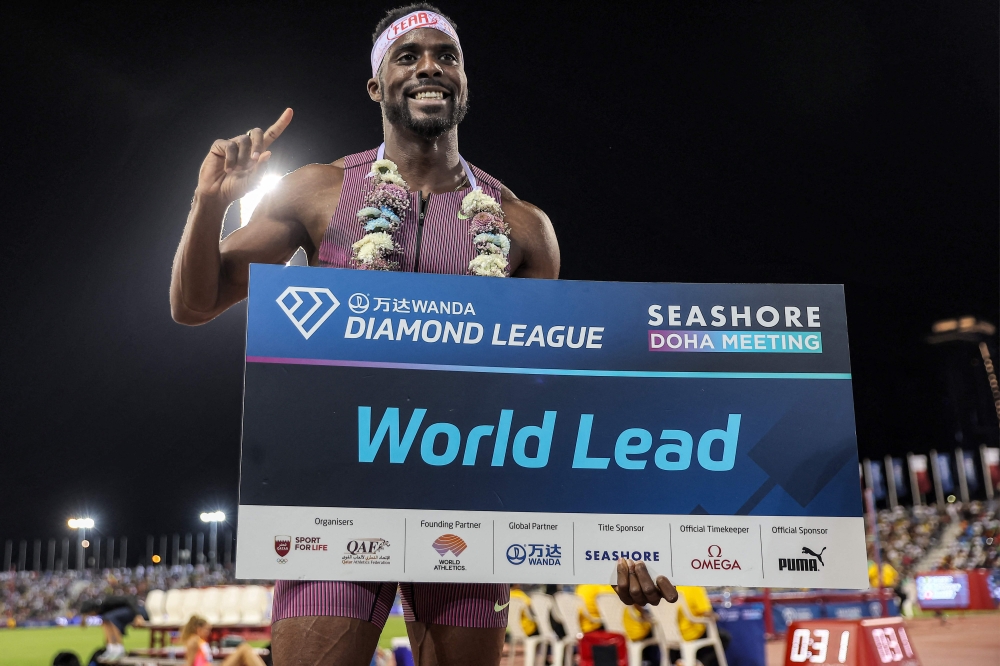 USA's Kenneth Bednarek celebrates after achieving a new world lead record in the men's 200m final race on May 10, 2024 at the Suheim Bin Hamad Stadium in Doha. (Photo by Karim Jaafar / AFP)