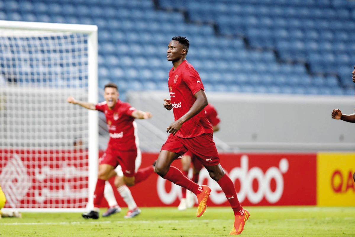 Al Duhail's Michael Olunga (right) celebrates after scoring his first goal. 