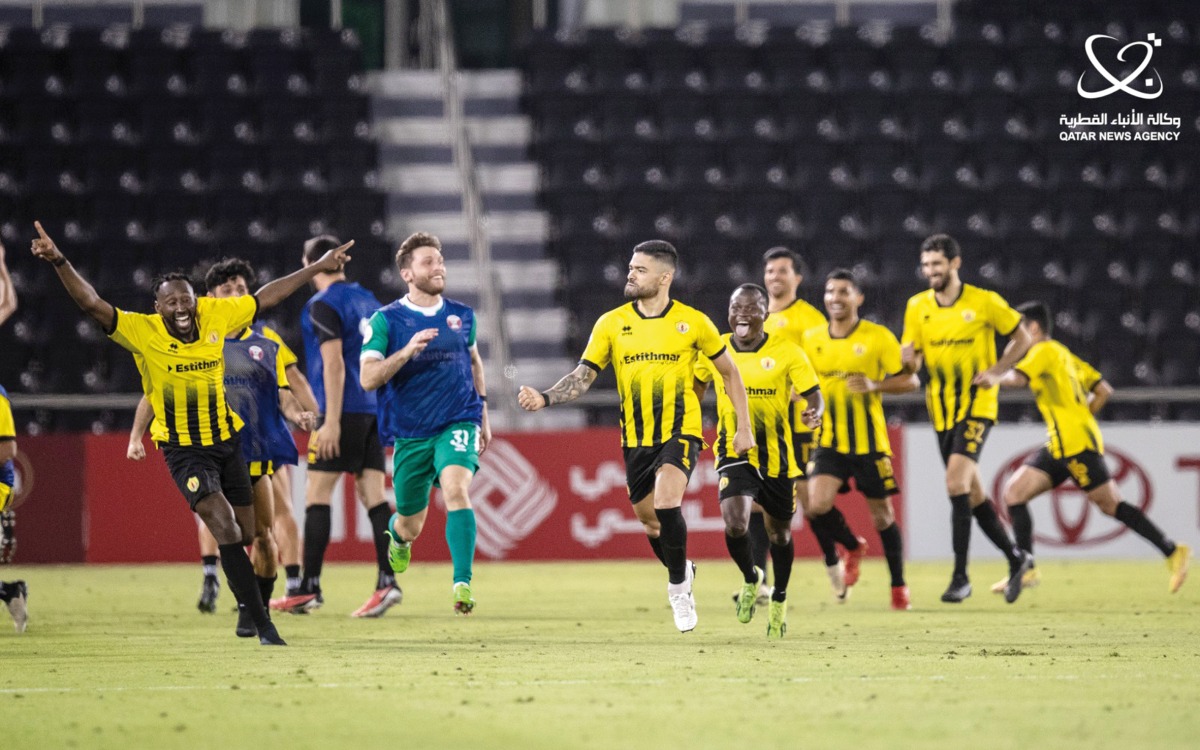 Qatar SC's players celebrate during the Amir Cup quarter-final match against Al Rayyan. 